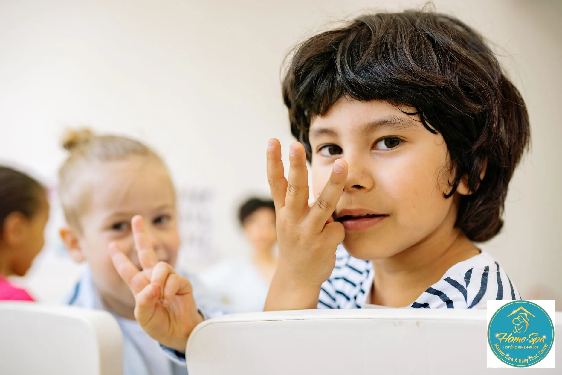 professional photo of an early childhood educator interacting with children in a bright, playful classroom setting, focus on engagement, 1024x1024