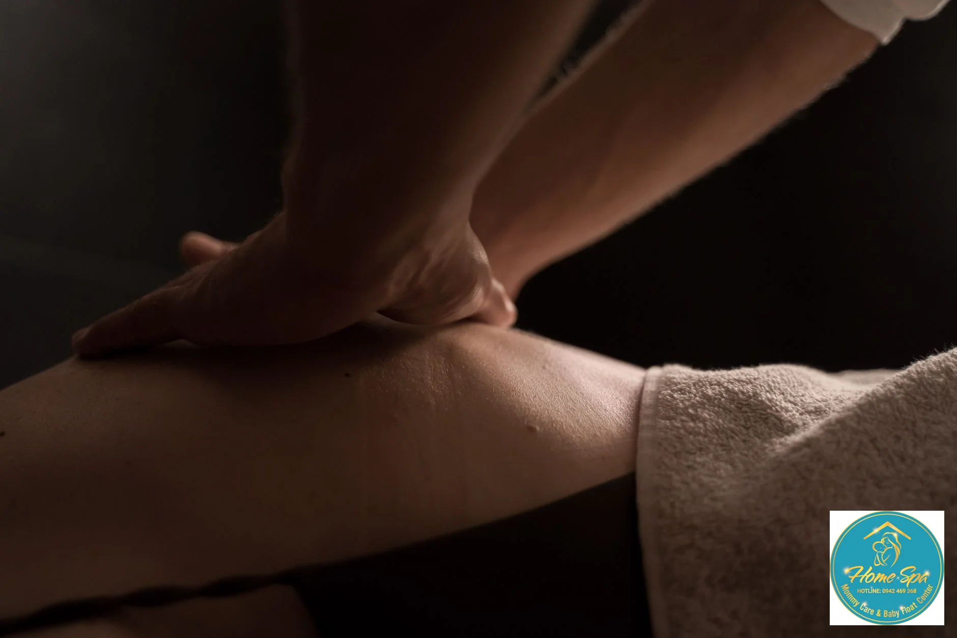 close-up professional photo of a baby receiving a gentle massage after a hydrotherapy session, warm lighting, skilled hands of a therapist, 1024x1024