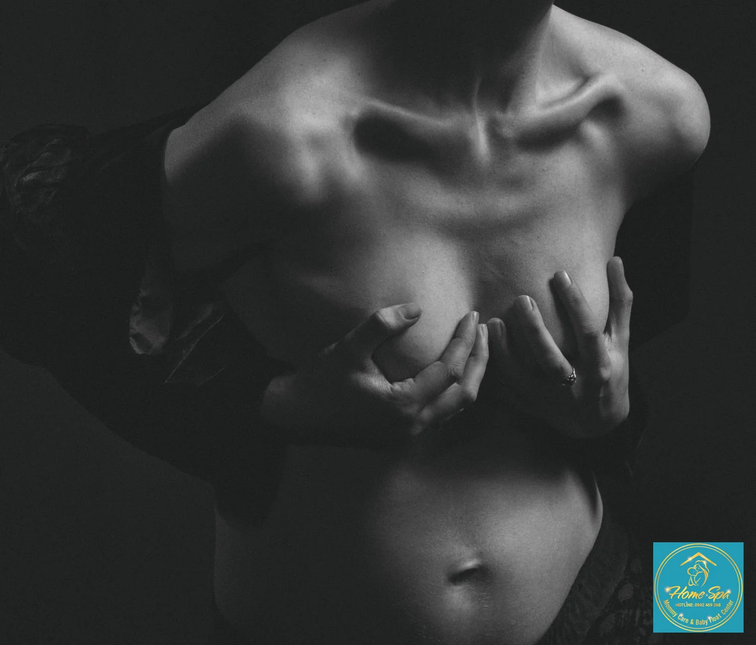 professional photo of a mother gently applying a warm compress to her breast, soft lighting, calm expression, 1024x1024