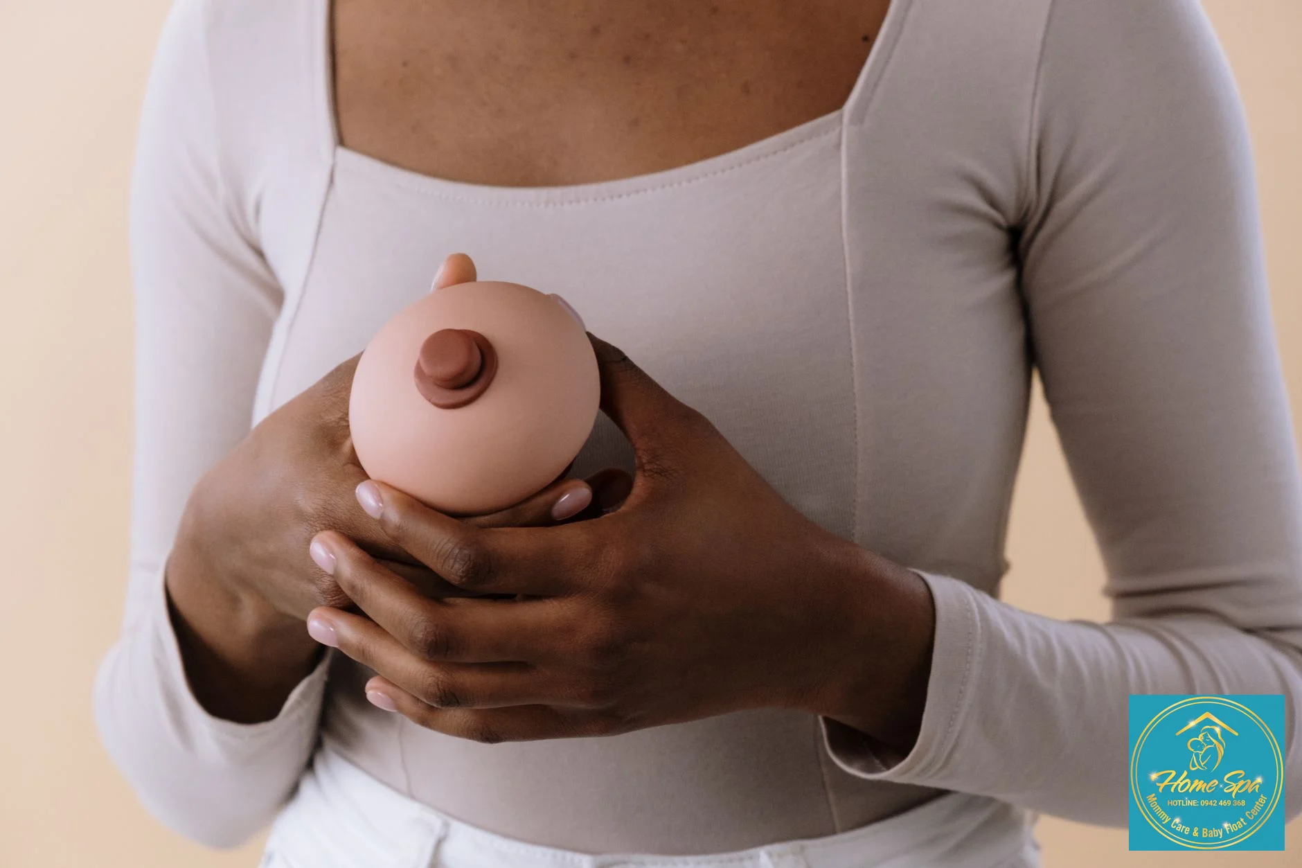 professional photo of a lactation consultant demonstrating breast massage techniques to a mother, focus on gentle touch and clear instruction, 1024x1024