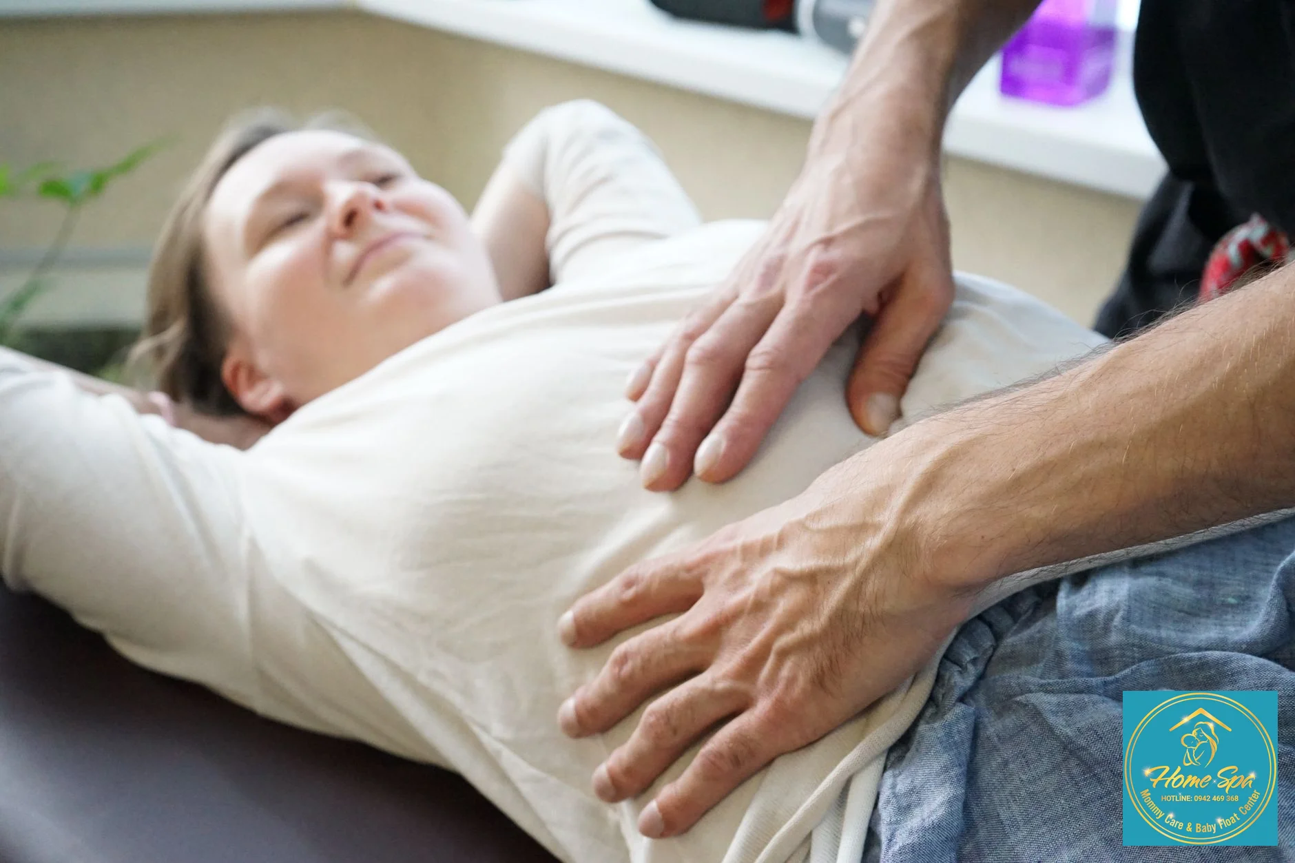 professional photo of a lactation consultant gently massaging a mother's breast to relieve clogged ducts, in a clean and calm home environment, 1024x1024