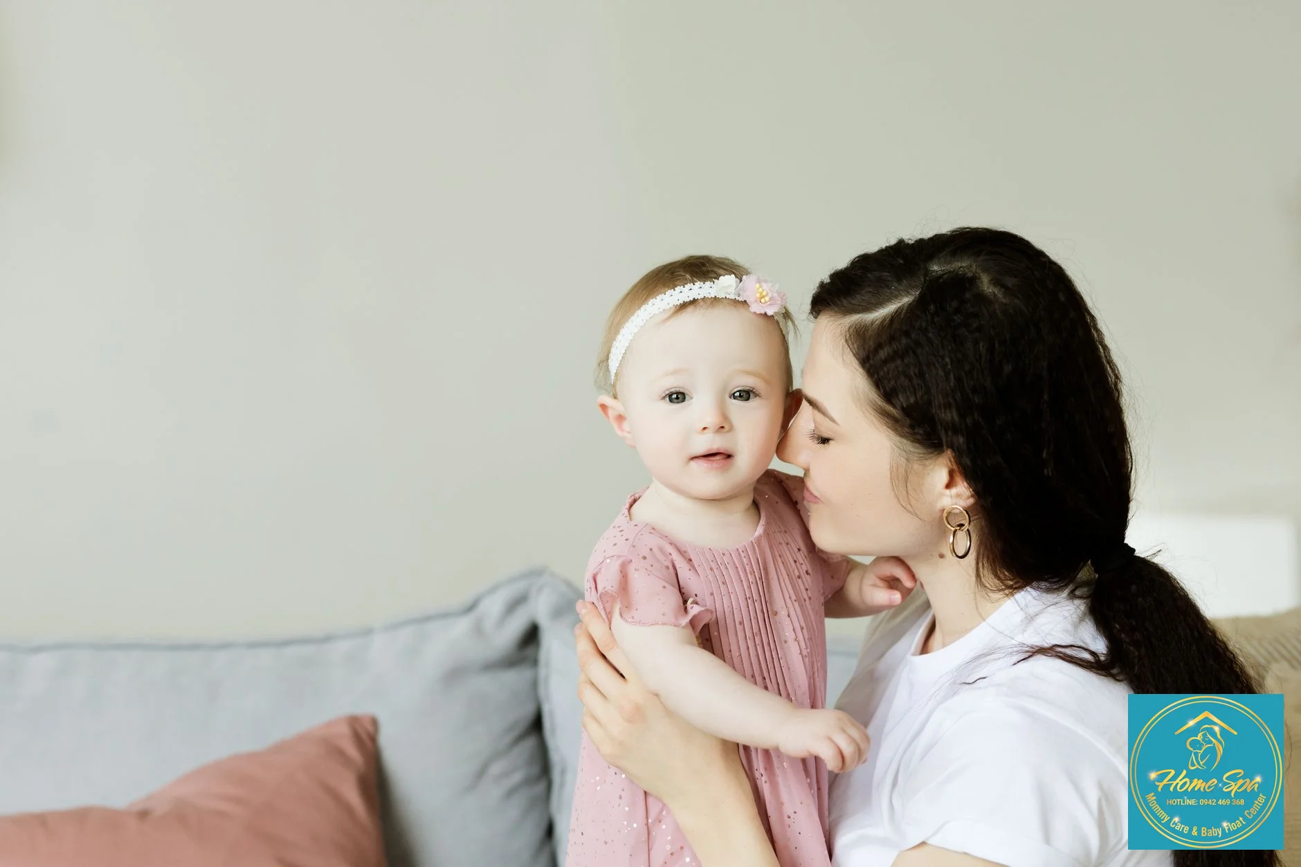 professional photo of a smiling mother holding her baby, expressing relief after successful breastfeeding, in a cozy home setting, 1024x1024