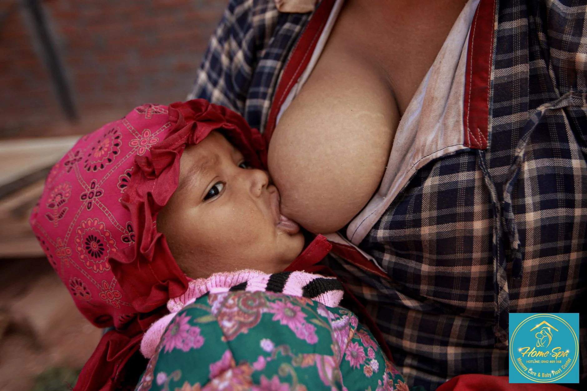 close-up of a mother gently holding her baby for breastfeeding, with a focus on proper latch and comfort, warm and inviting atmosphere, 1024x1024