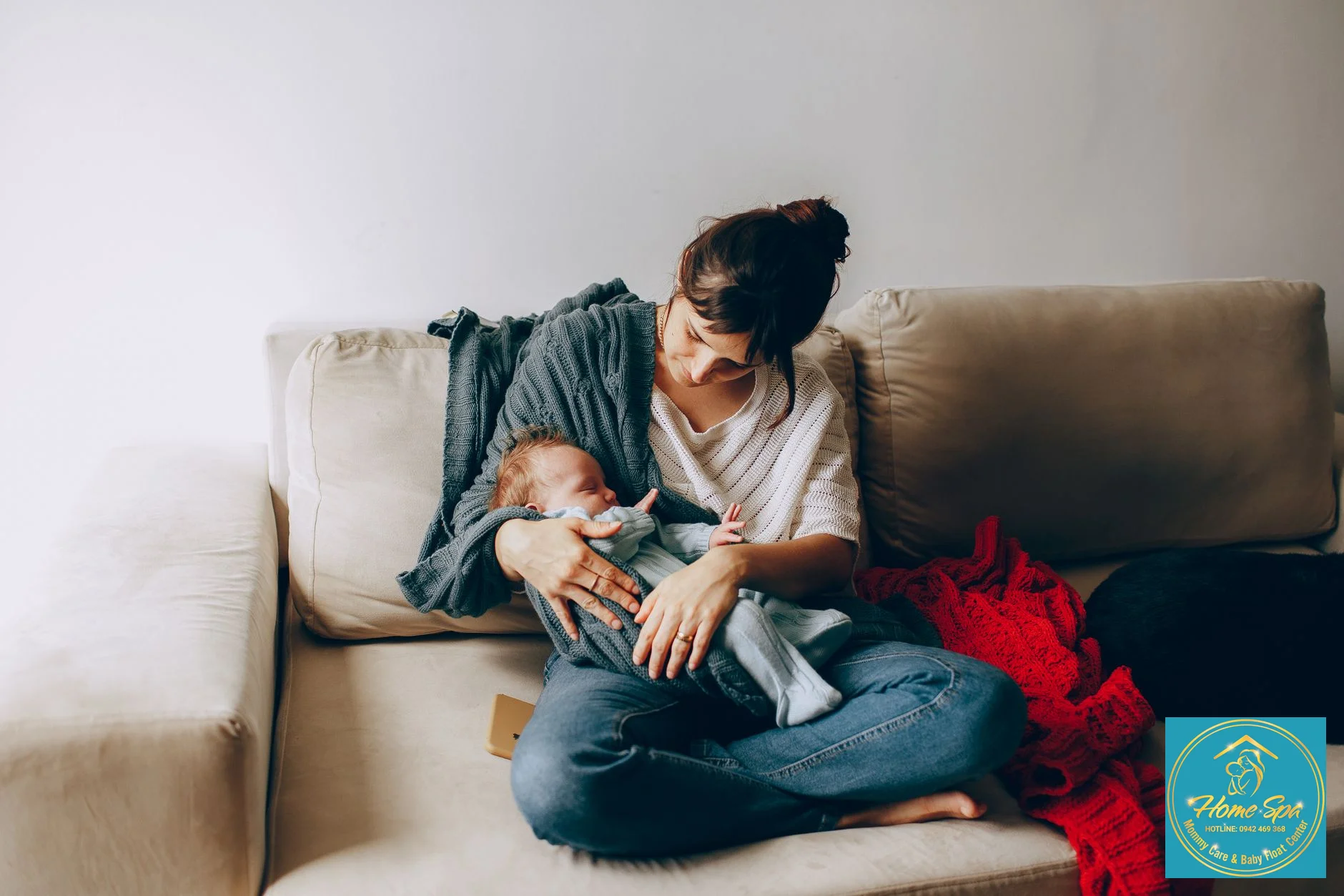 cozy indoor scene with a mother nursing her baby in winter, warm lighting, showing comfortable and loose clothing, 1024x1024